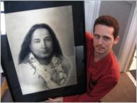 Picture of Stratford charcoal artist John A. Manley with one of his portraits recently custom-framed at My Custom Framer.